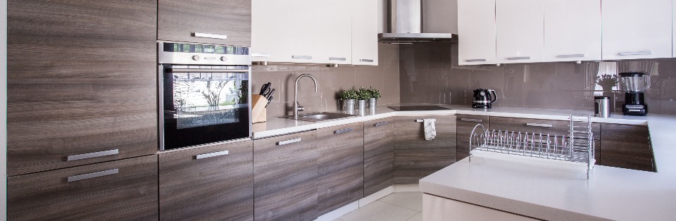 Wooden cupboards in cozy kitchen